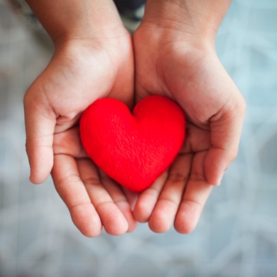 hand and red heart